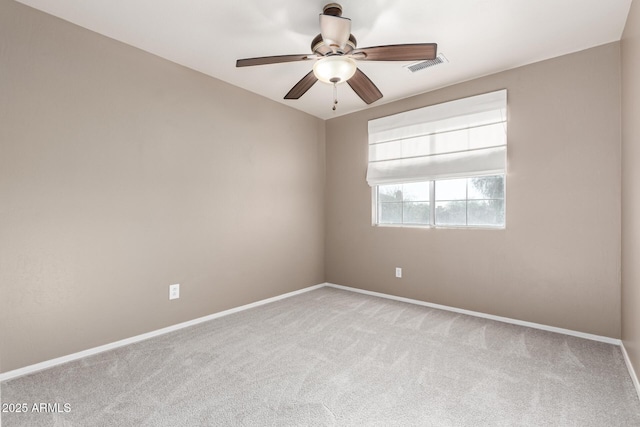 empty room with light colored carpet and ceiling fan