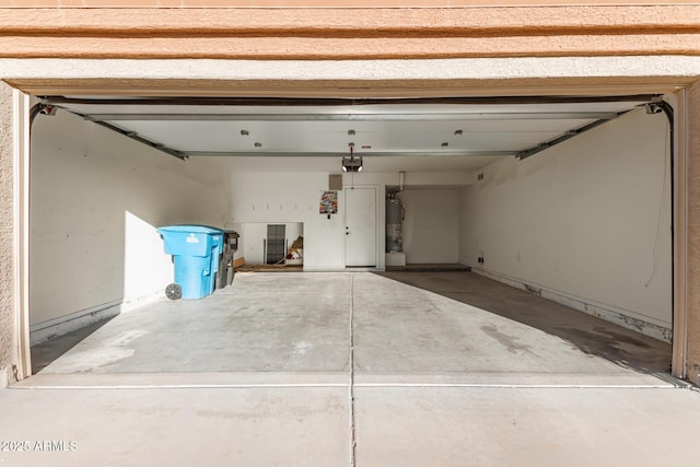 garage featuring a garage door opener and gas water heater