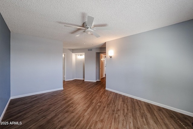 unfurnished room featuring wood finished floors, a textured ceiling, baseboards, and ceiling fan