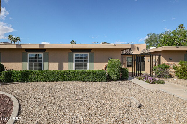 ranch-style home with stucco siding