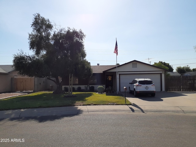 ranch-style home featuring a garage and a front yard