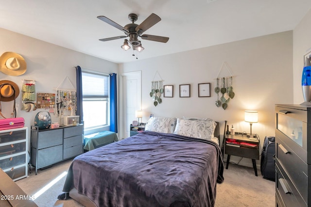 carpeted bedroom with ceiling fan