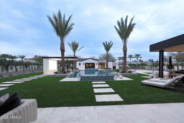 view of yard with an outdoor pool and a patio