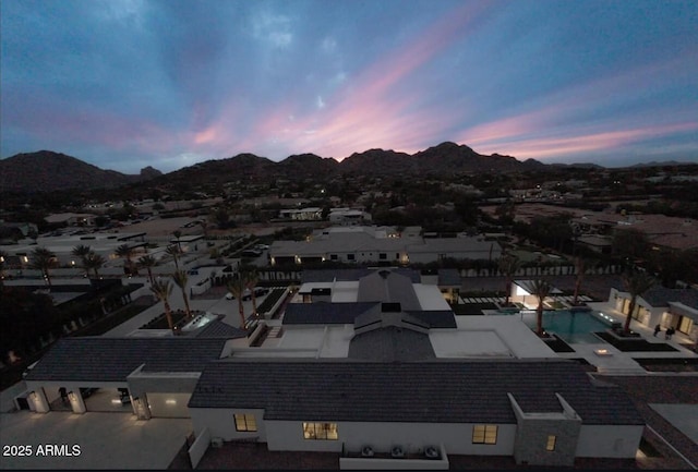 aerial view at dusk with a mountain view