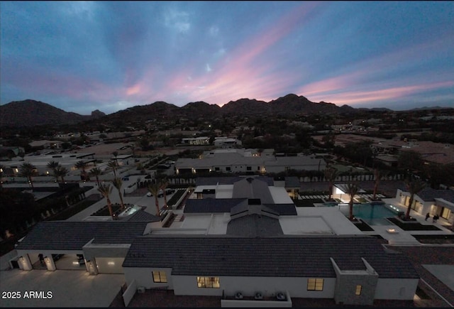 aerial view at dusk with a mountain view