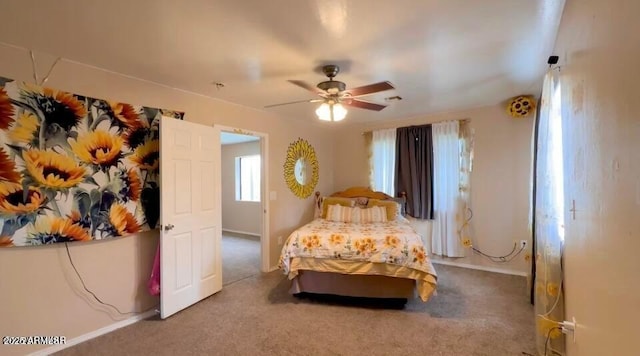 bedroom with carpet flooring, visible vents, and ceiling fan