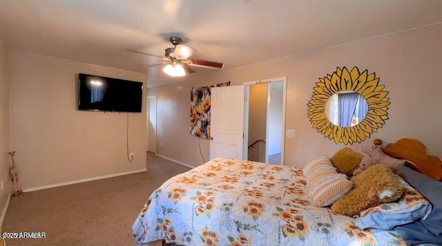 bedroom featuring a ceiling fan, baseboards, and dark colored carpet