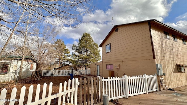 view of side of property with fence private yard