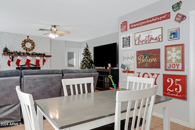 tiled dining area featuring ceiling fan