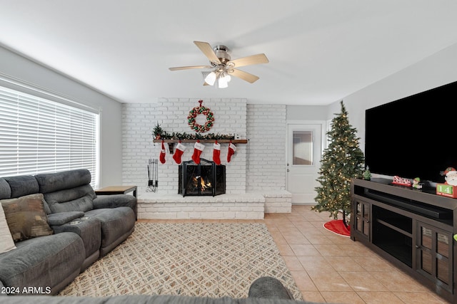 living room with ceiling fan, light tile patterned floors, and a fireplace