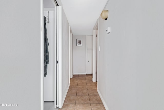 hallway featuring light tile patterned flooring