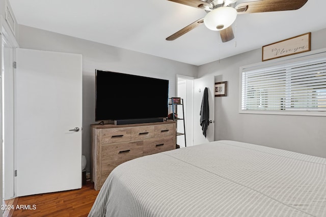 bedroom with hardwood / wood-style flooring and ceiling fan