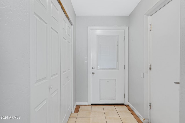 entryway featuring light tile patterned floors