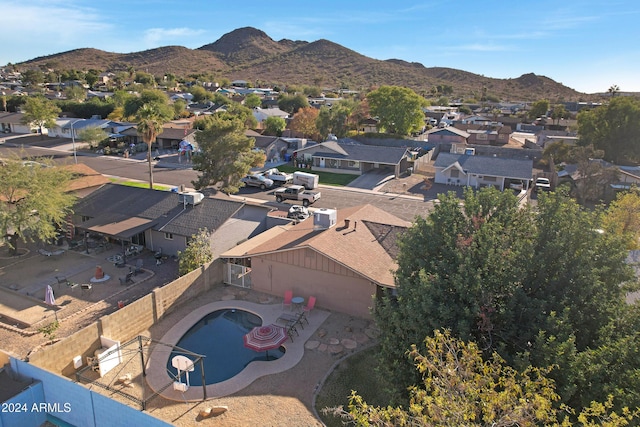 birds eye view of property with a mountain view