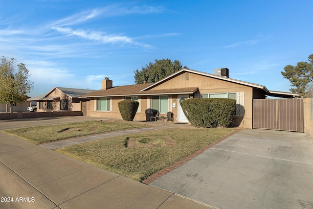 ranch-style house with a front yard