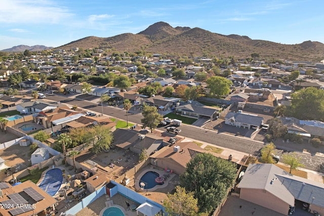 birds eye view of property featuring a mountain view