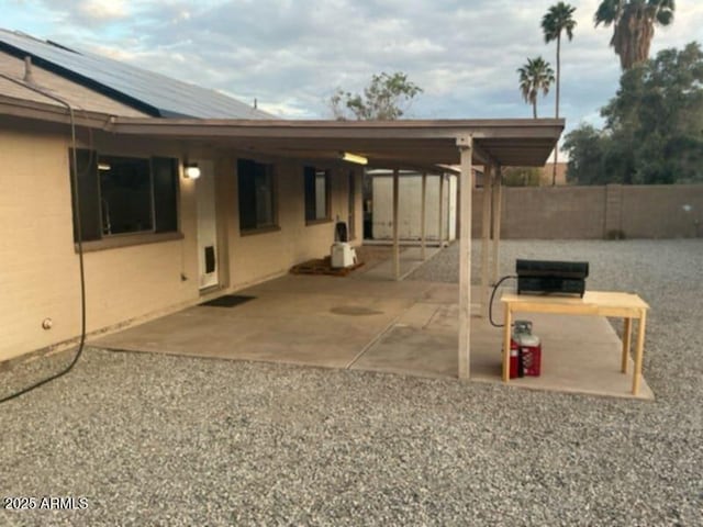 view of patio featuring fence