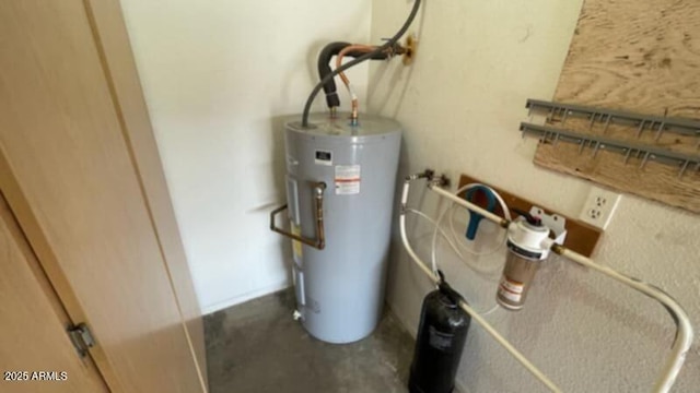 utility room featuring water heater