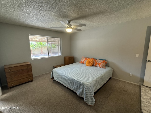 carpeted bedroom with baseboards, ceiling fan, and a textured ceiling