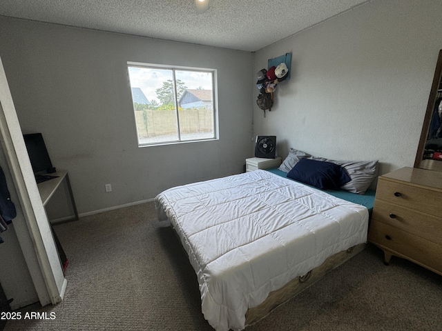 carpeted bedroom with a textured ceiling