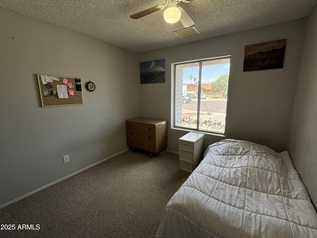 bedroom featuring carpet flooring, a ceiling fan, a textured ceiling, visible vents, and baseboards