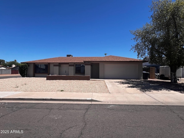 662 W Laguna Azul Ave, Mesa, AZ 85210 - ranch-style home featuring a garage, driveway, and stucco siding