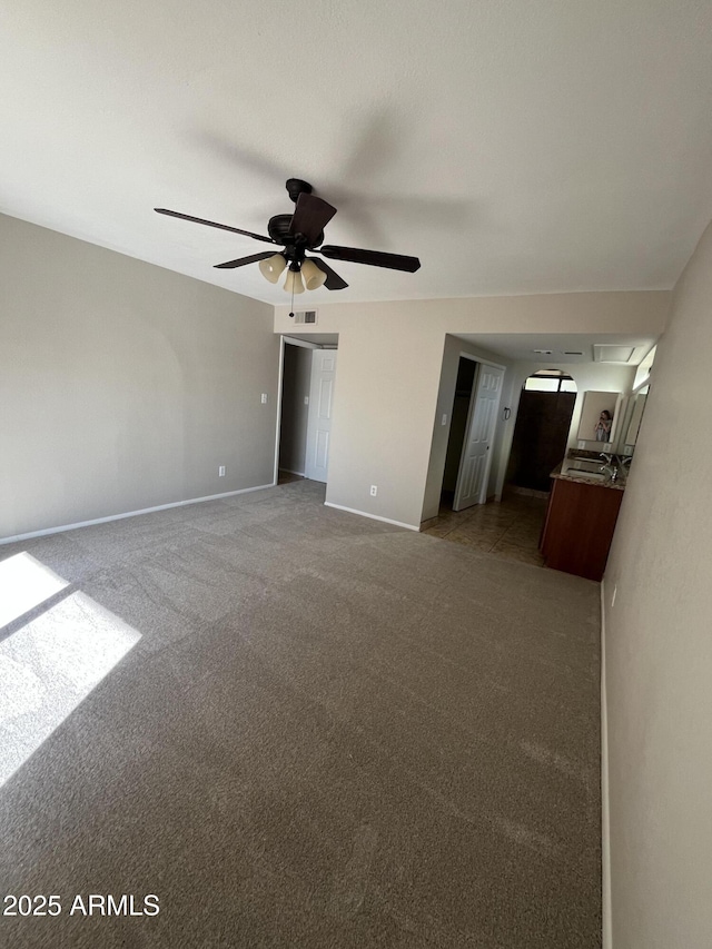662 W Laguna Azul Ave, Mesa, AZ 85210 - empty room with a ceiling fan and light colored carpet