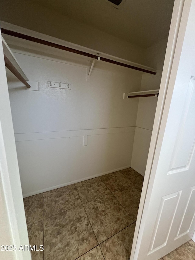 662 W Laguna Azul Ave, Mesa, AZ 85210 - spacious closet featuring tile patterned floors