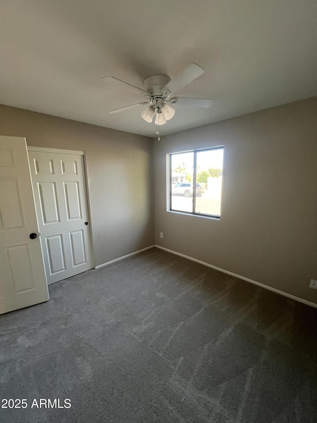 662 W Laguna Azul Ave, Mesa, AZ 85210 - unfurnished bedroom with dark colored carpet and a ceiling fan