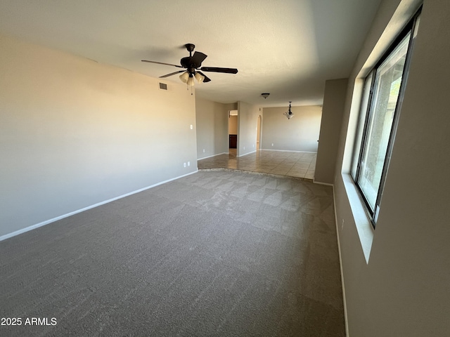 662 W Laguna Azul Ave, Mesa, AZ 85210 - spare room featuring carpet flooring and a ceiling fan