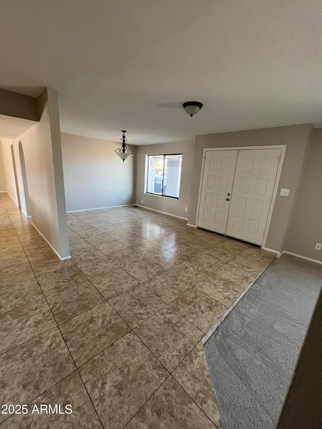 662 W Laguna Azul Ave, Mesa, AZ 85210 - entrance foyer with tile patterned flooring and a chandelier