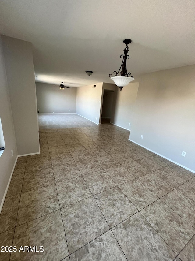 662 W Laguna Azul Ave, Mesa, AZ 85210 - tiled empty room featuring baseboards