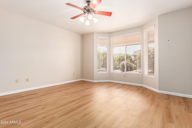 unfurnished room featuring light hardwood / wood-style floors and ceiling fan