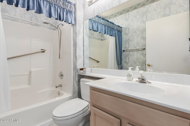 full bathroom featuring shower / bath combo, vanity, and toilet