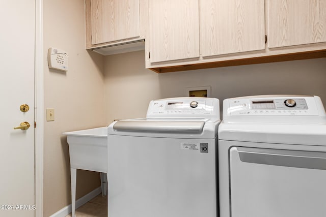 laundry area featuring cabinets and washer and dryer