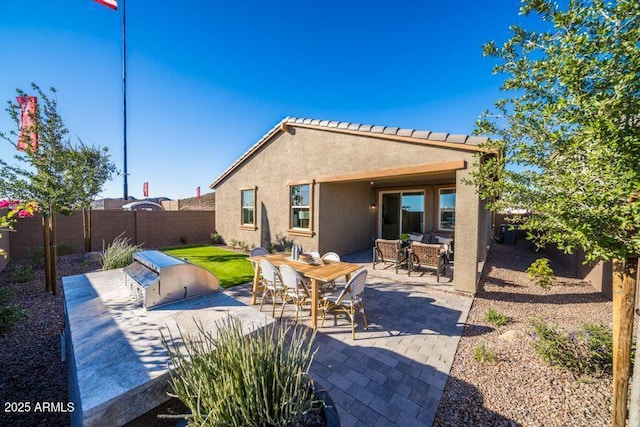12239 W Caraveo Pl, Peoria, AZ 85383 - rear view of property with a fenced backyard, stucco siding, a patio area, and outdoor dining area