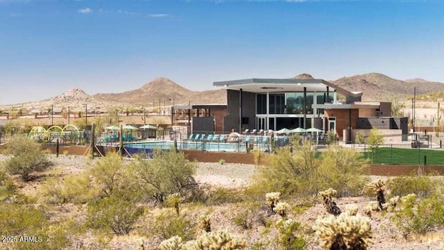 12239 W Caraveo Pl, Peoria, AZ 85383 - rear view of house with a mountain view and fence