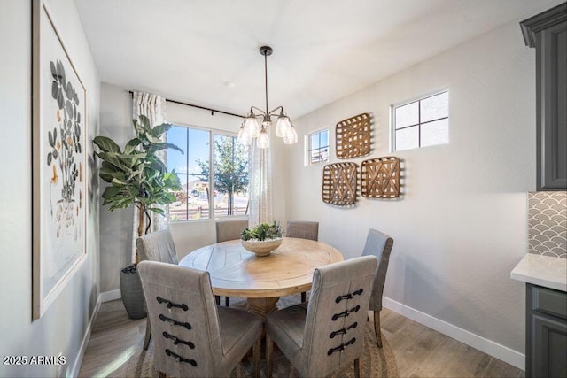 12239 W Caraveo Pl, Peoria, AZ 85383 - dining area with baseboards and light wood-style flooring