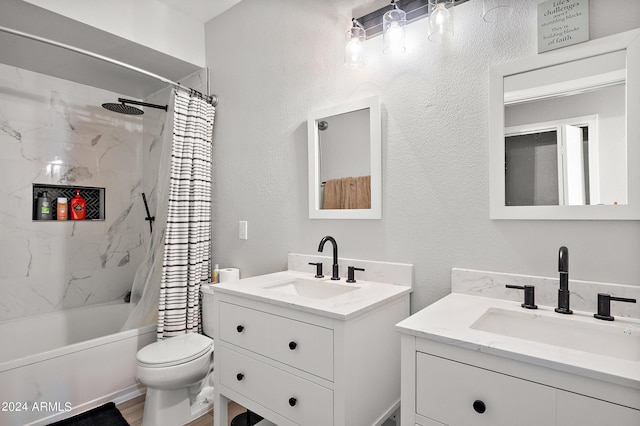 bathroom with a textured wall, two vanities, a sink, and shower / tub combo with curtain