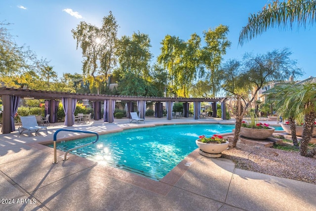 pool featuring a patio and a pergola