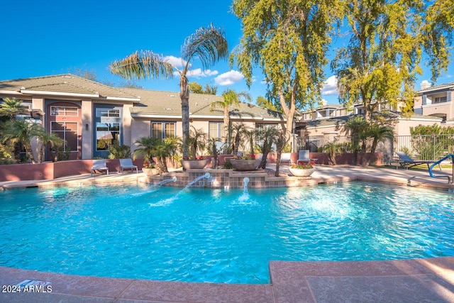 view of pool featuring a patio, fence, and a fenced in pool