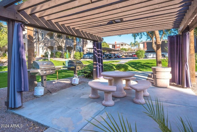 view of patio with a grill and a pergola