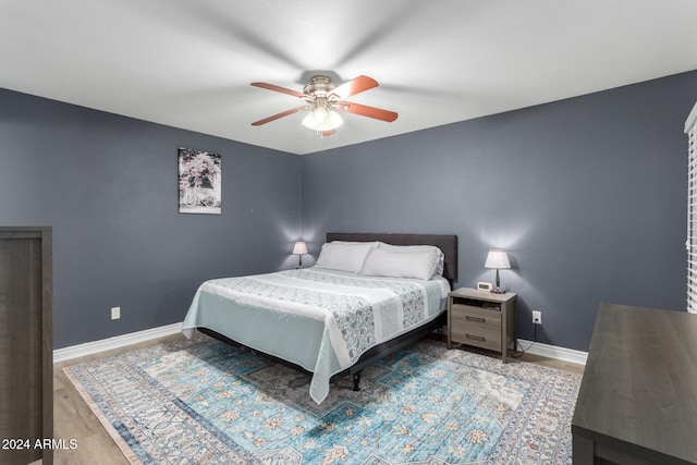 bedroom featuring hardwood / wood-style flooring and ceiling fan