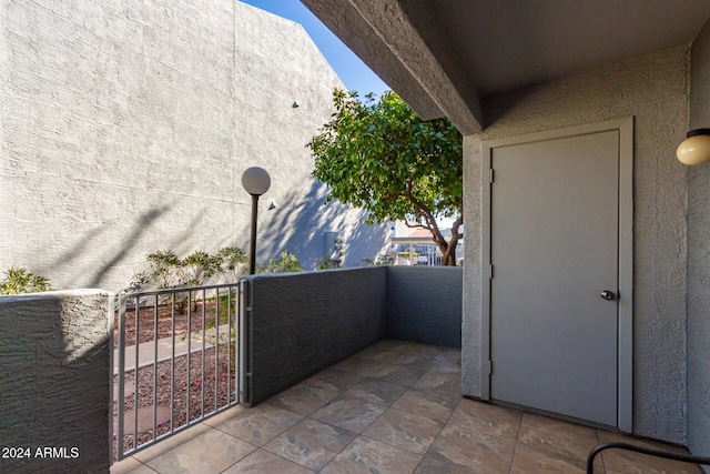 view of patio featuring a balcony