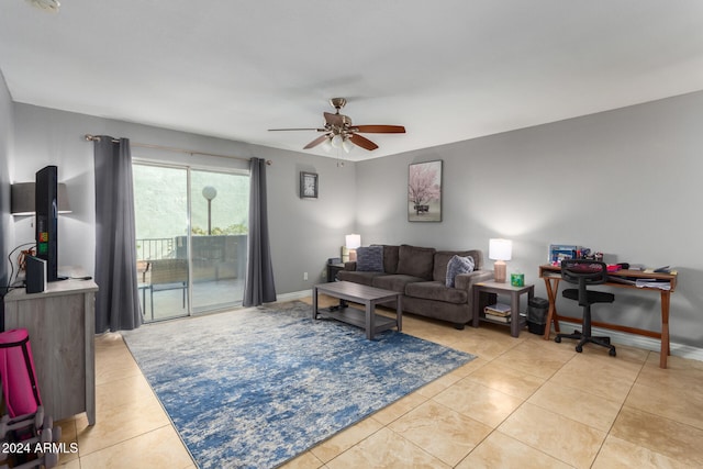 living room featuring ceiling fan and light tile patterned flooring