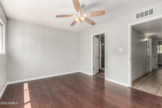 725 S Power Rd Unit 101, Mesa, AZ 85206 - empty room with a ceiling fan and wood finished floors