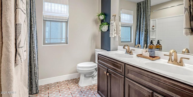 43256 N Hinoki St, Queen Creek, AZ 85140 - bathroom featuring toilet, baseboards, double vanity, and tile patterned floors