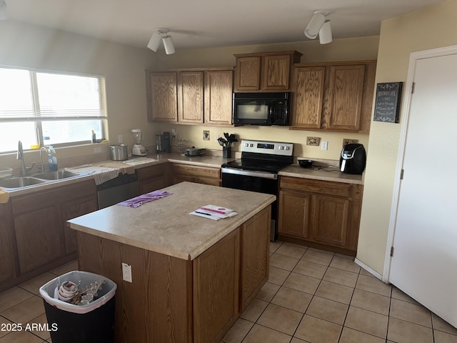 1206 W Pinkley Ave, Coolidge, AZ 85128 - kitchen featuring light tile patterned floors, a sink, stainless steel range with electric stovetop, and black microwave