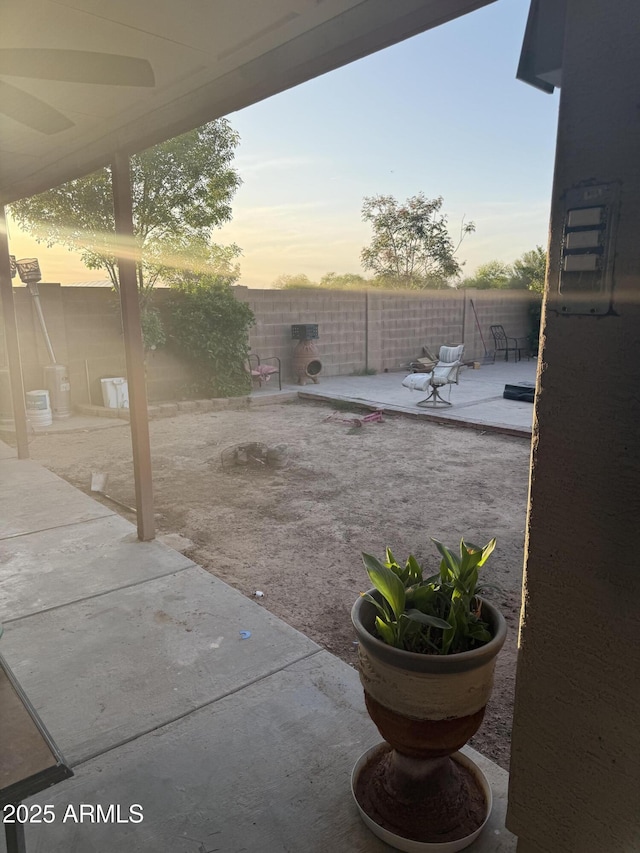 1206 W Pinkley Ave, Coolidge, AZ 85128 - yard at dusk with a patio area and a fenced backyard