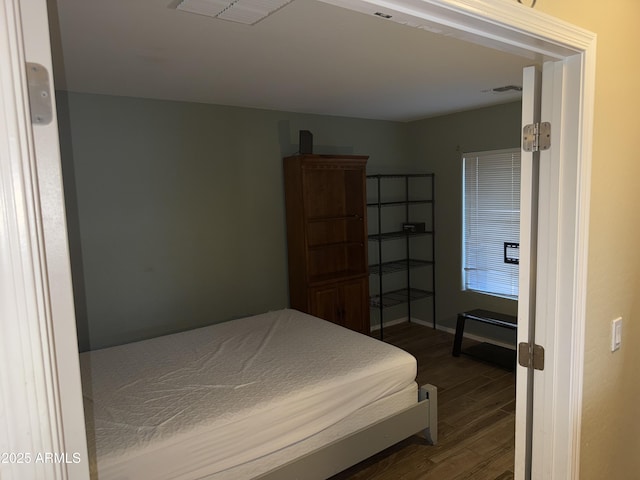 1206 W Pinkley Ave, Coolidge, AZ 85128 - bedroom with visible vents, baseboards, and dark wood finished floors